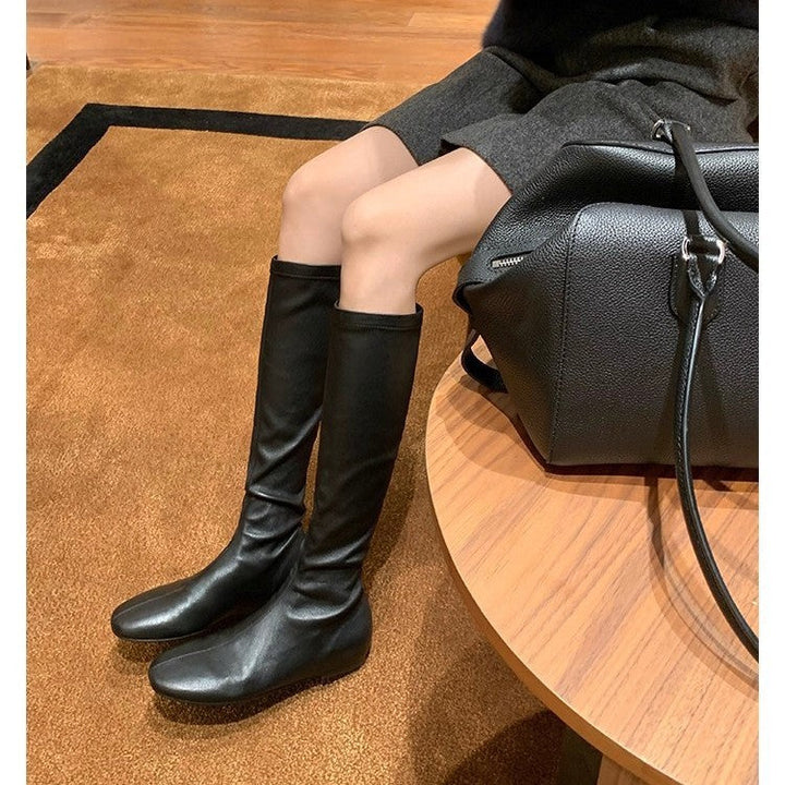 Women's Leather Knee-high Boots with a Slim Silhouette and Flat Heel