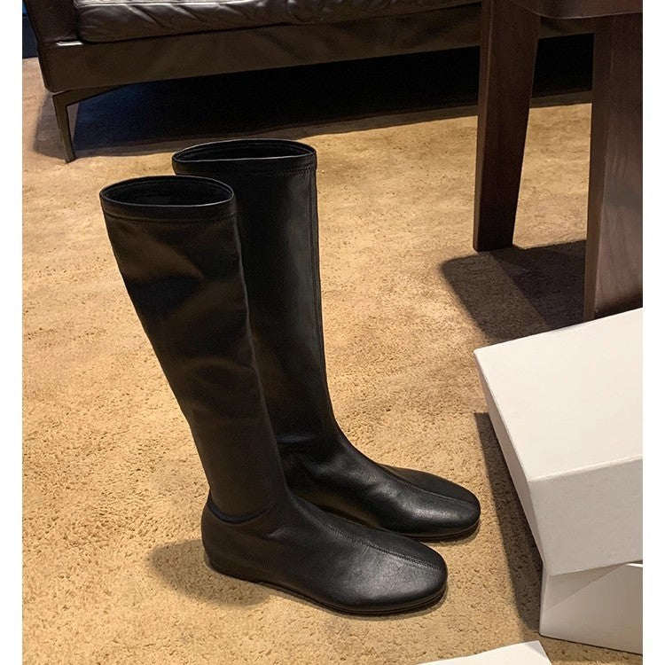 Women's Leather Knee-high Boots with a Slim Silhouette and Flat Heel