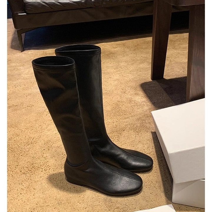 Women's Leather Knee-high Boots with a Slim Silhouette and Flat Heel