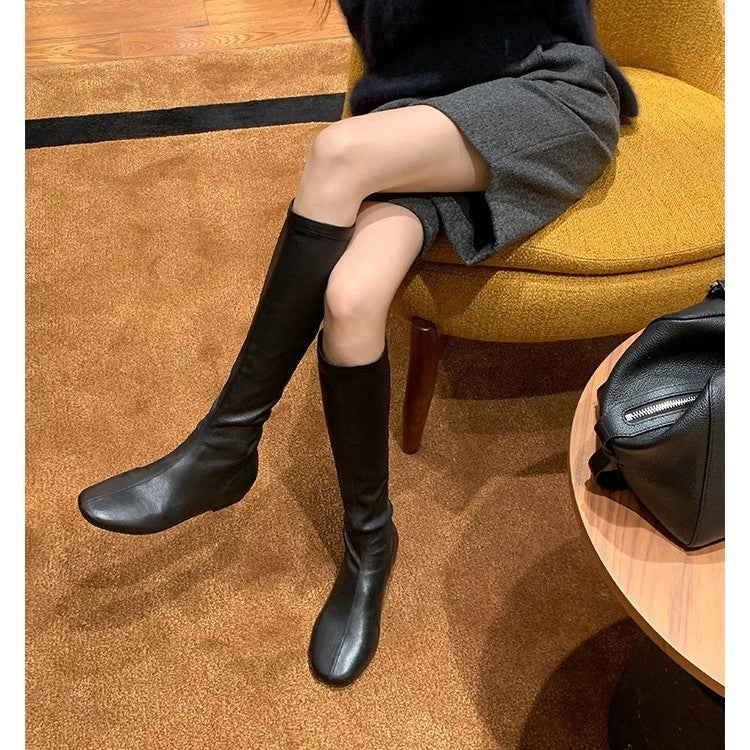 Women's Leather Knee-high Boots with a Slim Silhouette and Flat Heel