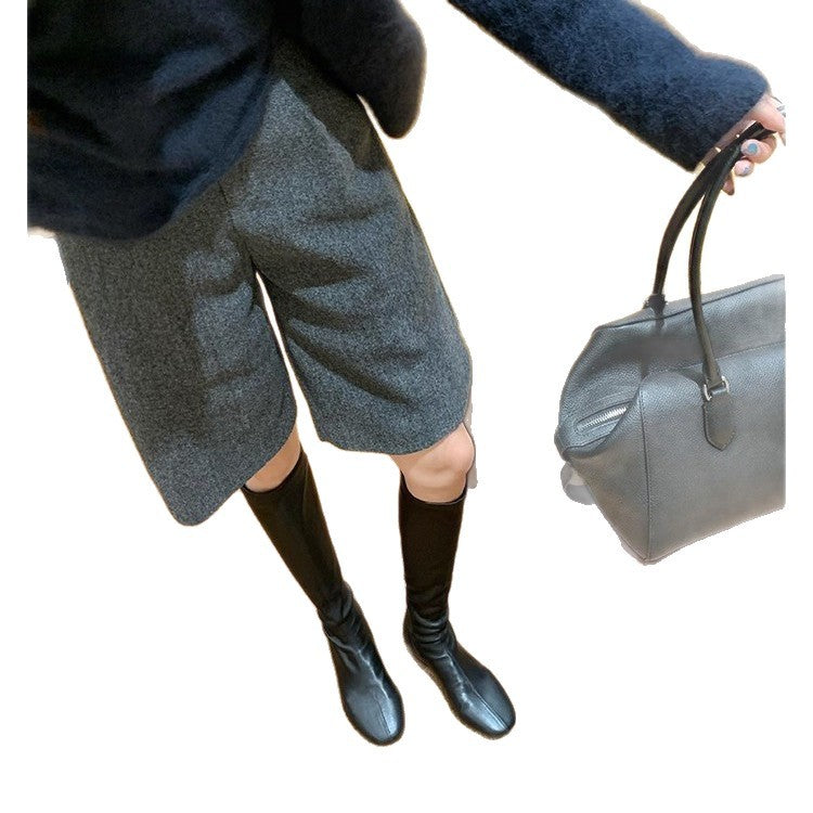 Women's Leather Knee-high Boots with a Slim Silhouette and Flat Heel