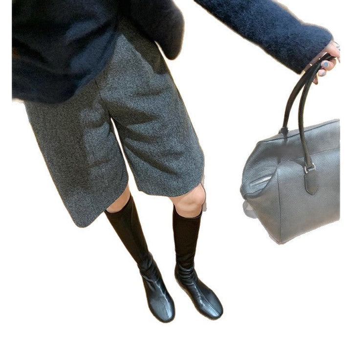 Women's Leather Knee-high Boots with a Slim Silhouette and Flat Heel