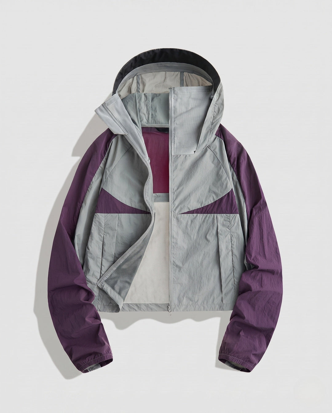 Women's Lightweight Functional Jacket with Breathable Inserts and Adjustable Hood Design