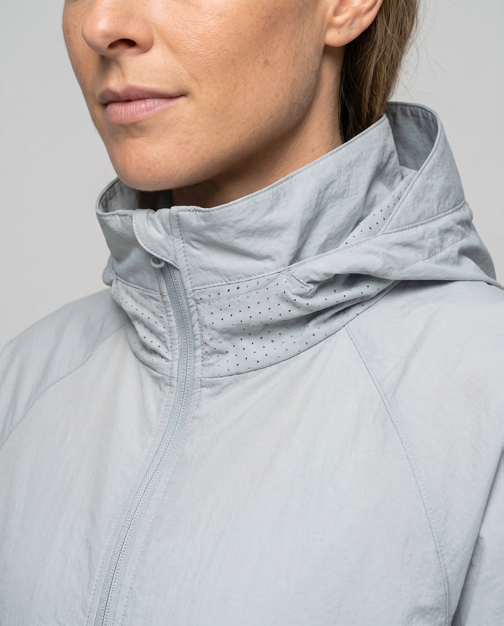Women's Lightweight Windbreaker Jacket with Adjustable Hood Design and Side Pockets